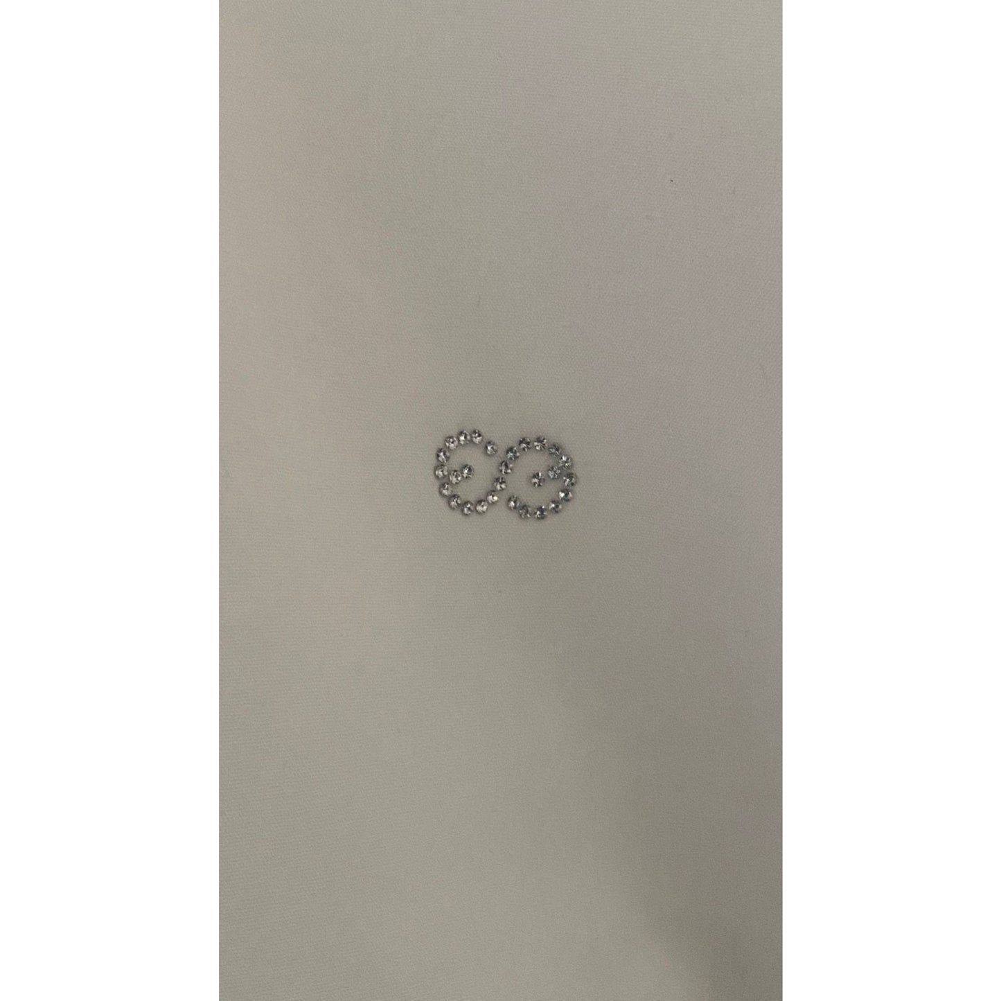 Escada Sport Size 12This Escada Sport white shirt is a perfect blend of style and functionality. This premier branded shirt, features a classic white button shirt design with decorative frills along the button seams and cuffed sleeves. For added sparkle, it is completed with a diamante motif. Preloved