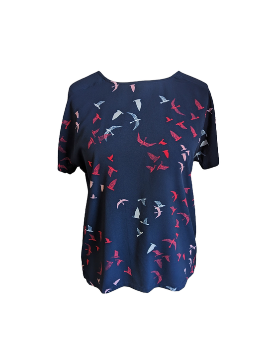 M&S Collection offers an ideal way to showcase your style. The front of the top is crafted from a navy blue Crepe feel material, while the back is made from a comfortable T-shirt material. The design features beautiful Birds, giving this top a unique and eye-catching look. Available in size 12. Preloved 