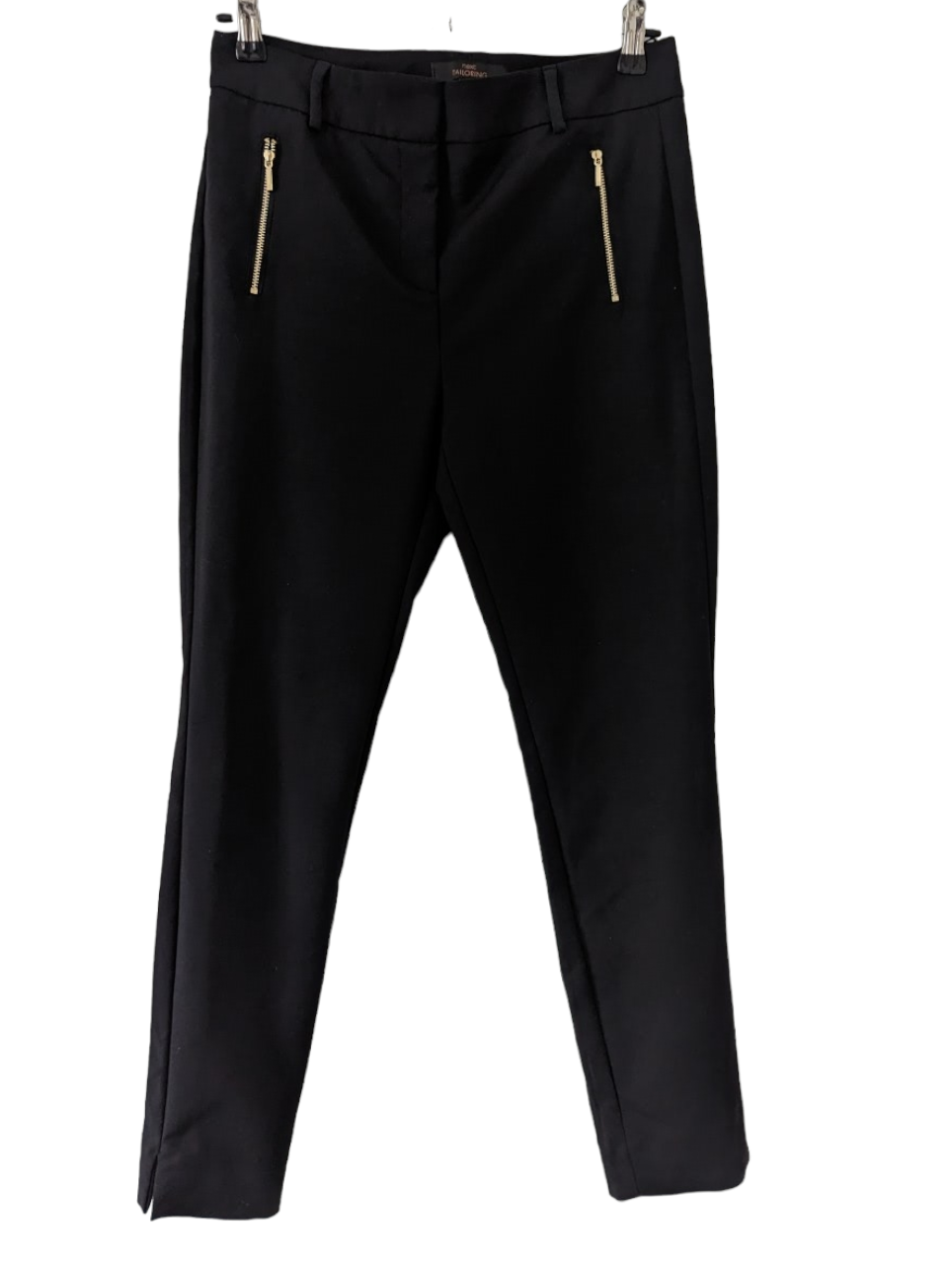 The Next Tailoring Black Trousers feature a slim silhouette, black finish and gold zip detailing for an understated yet stylish look. The trousers also feature slight slits on the leg cuffs for subtle movement. Suitable for any occasion, these trousers come in size 10 Regular. Preloved