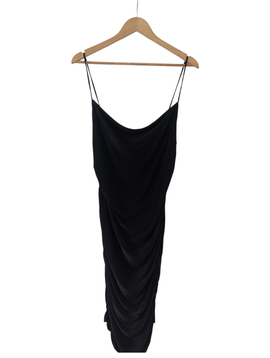 The Flattering Black Dress by Femme Luxe offers an elevated look with rouged back and sides and a perfect fit with very stretchy fabric and Size 12. Be confident you'll look your best with tags included. Preloved